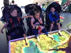 Using sand as a dry messy play activity