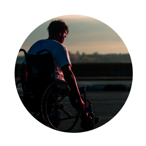 Man in wheelchair at sunset