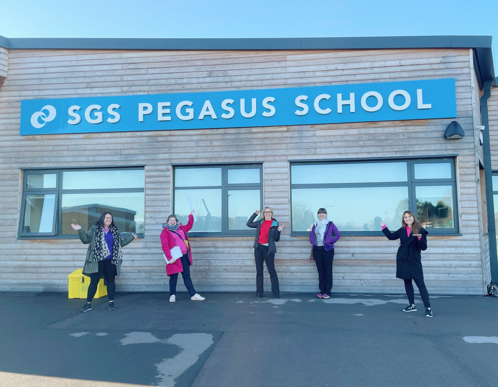 Gympanzees staff outside SGS Pegasus School