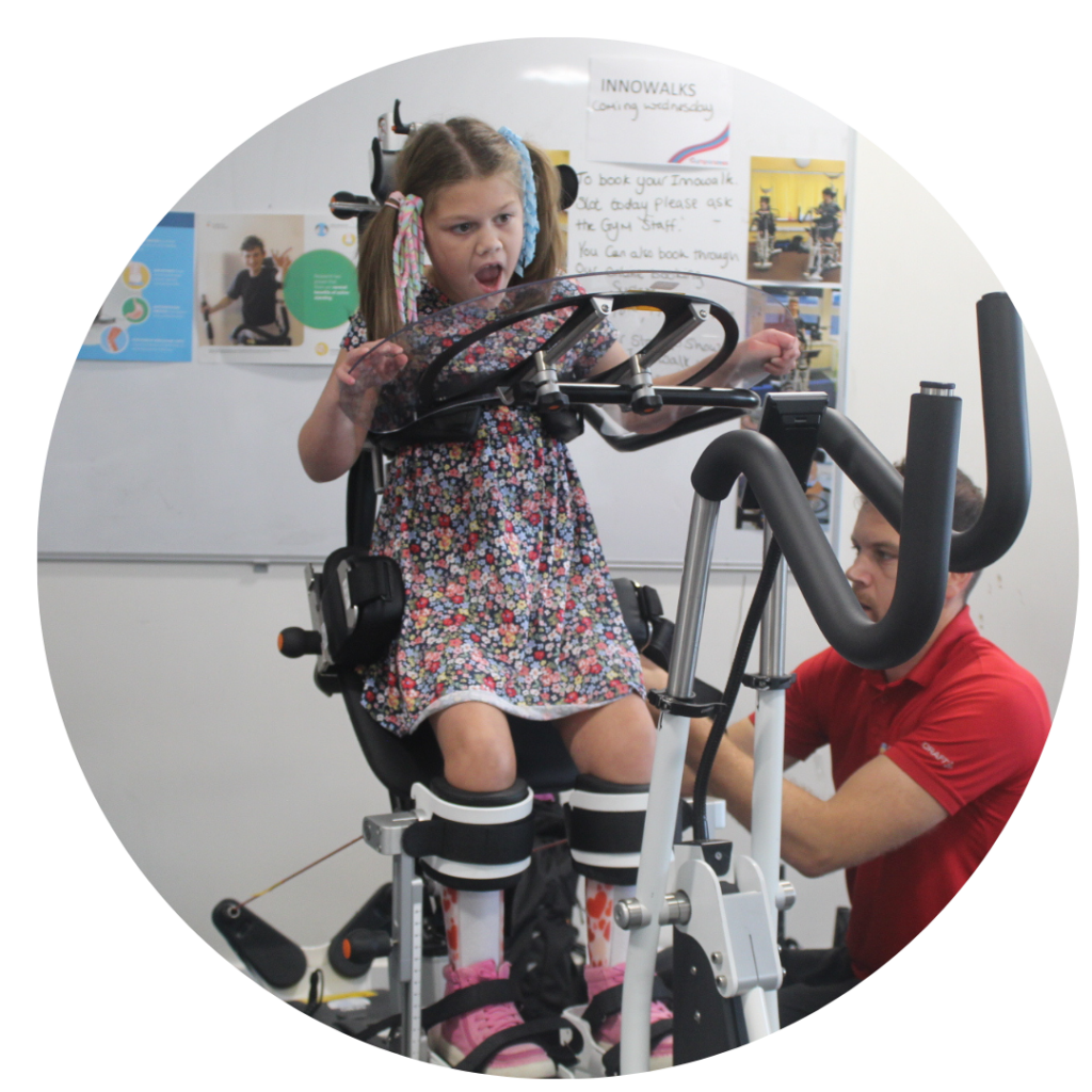 A young child using an assisted walker.