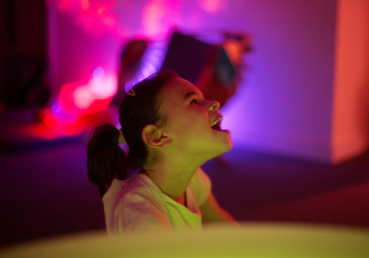 A young person in a calm sensory room
