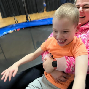 A woman and her child bouncing on a trampoline at Gympanzees Pop Up