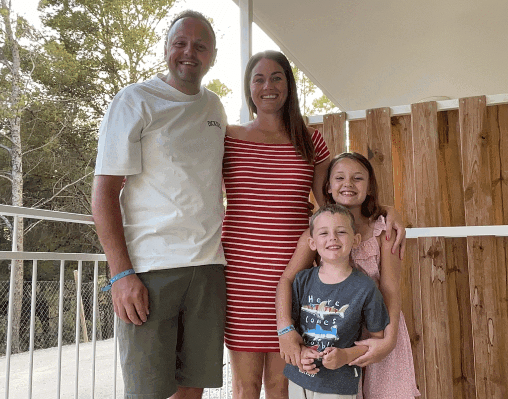 A picture of a family on a balcony